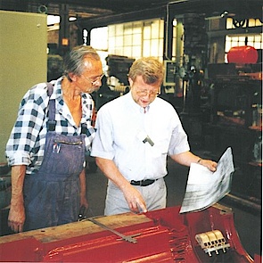 Kurt Menzel reviews technical motor dimensions with employee