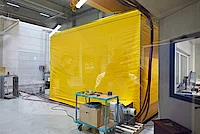 Engineer monitoring high voltage motor in thermal tent