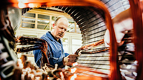 Inserting copper coils into an electric motor