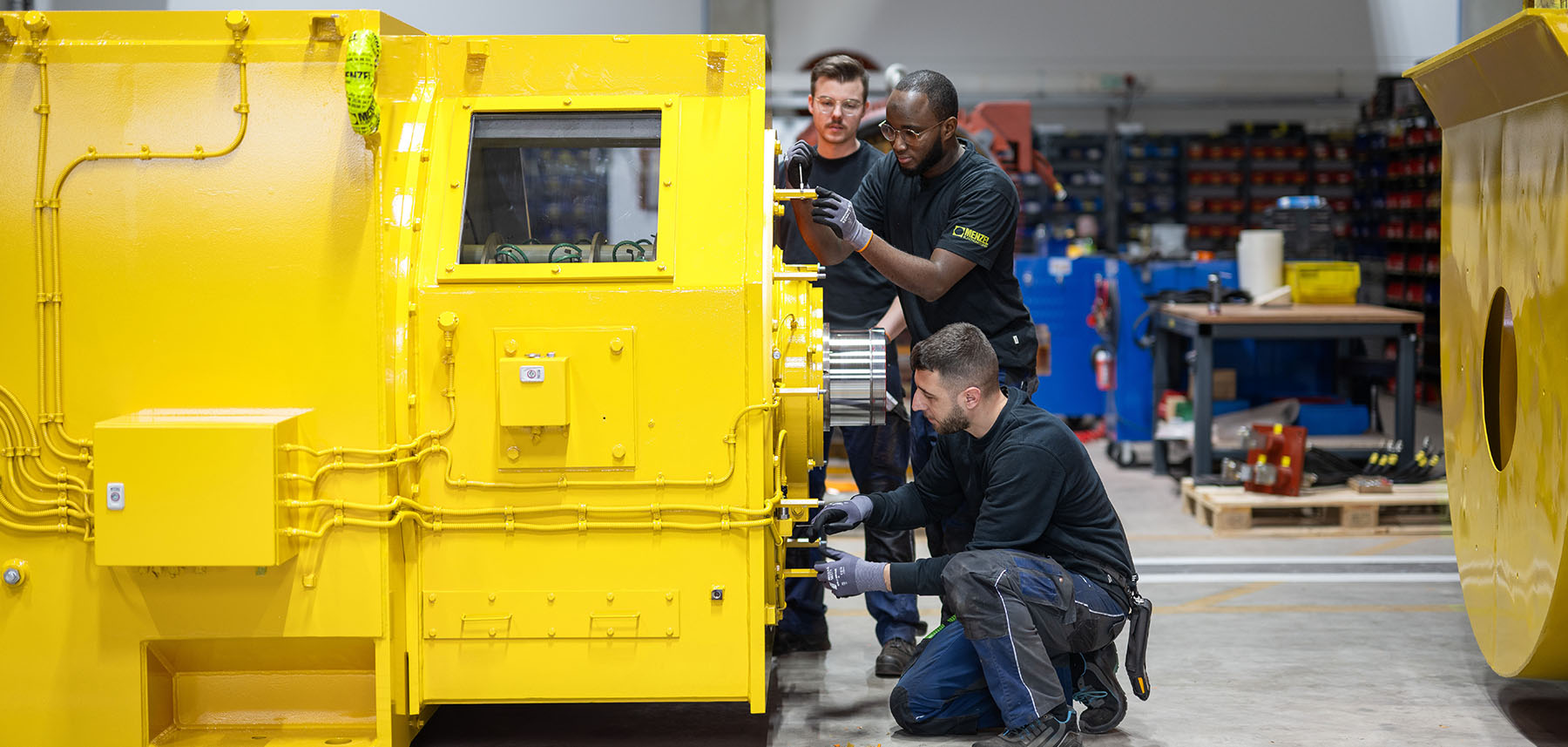 Technician assembling large electric motor