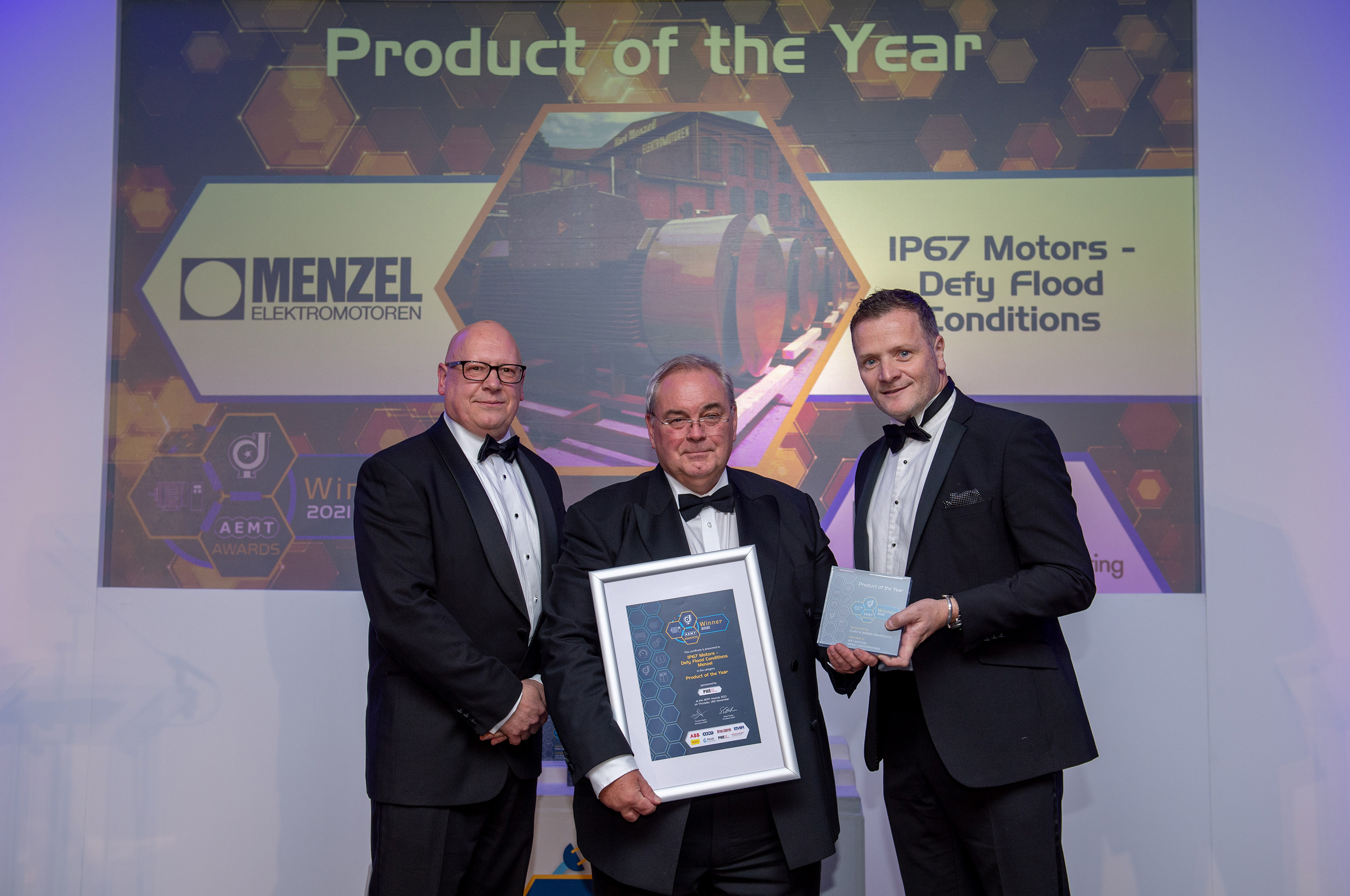 Menzel receiving the AEMT Product of the Year award '21 