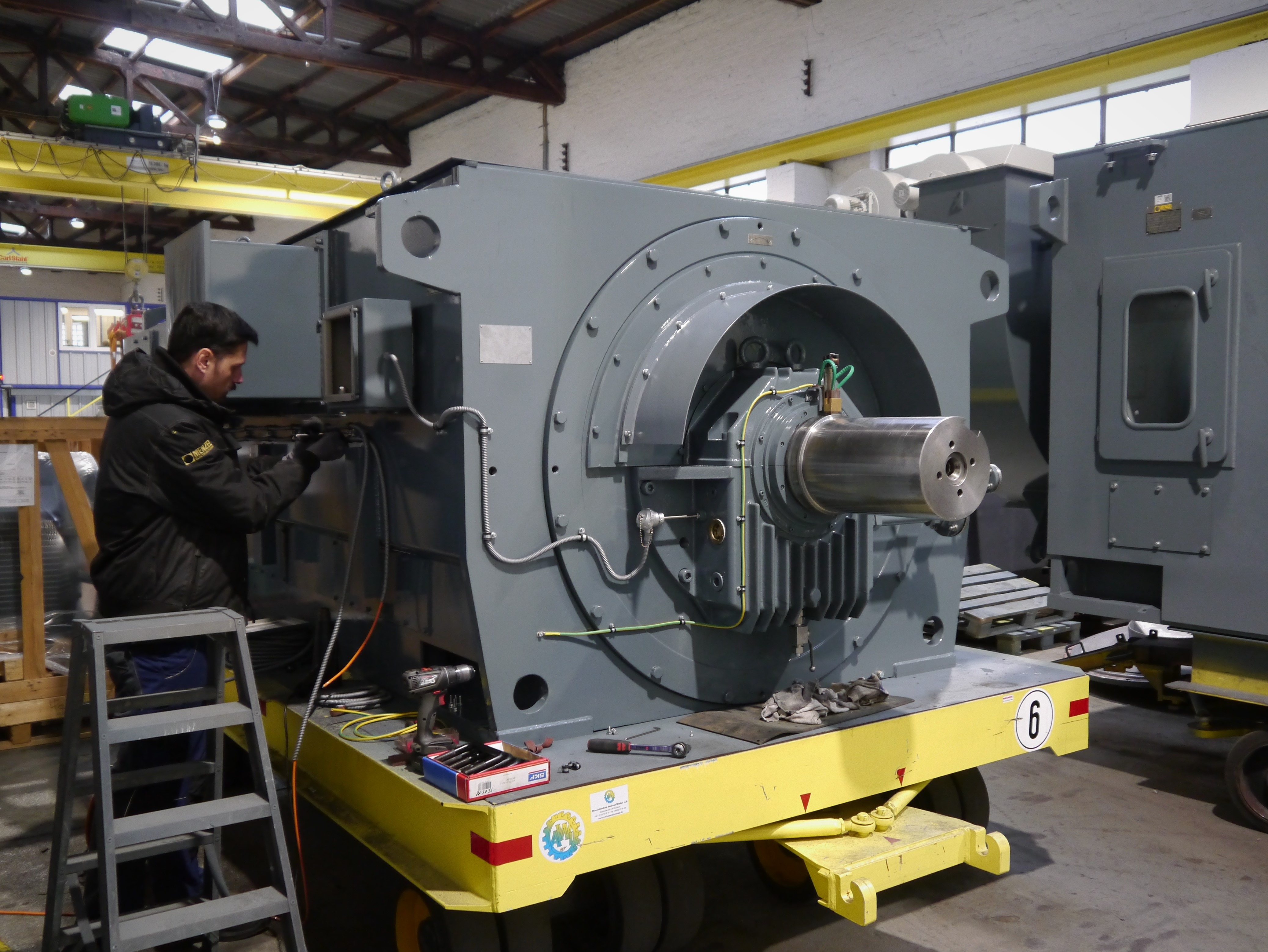 Installing sensor cables on a water-cooled high voltage motor